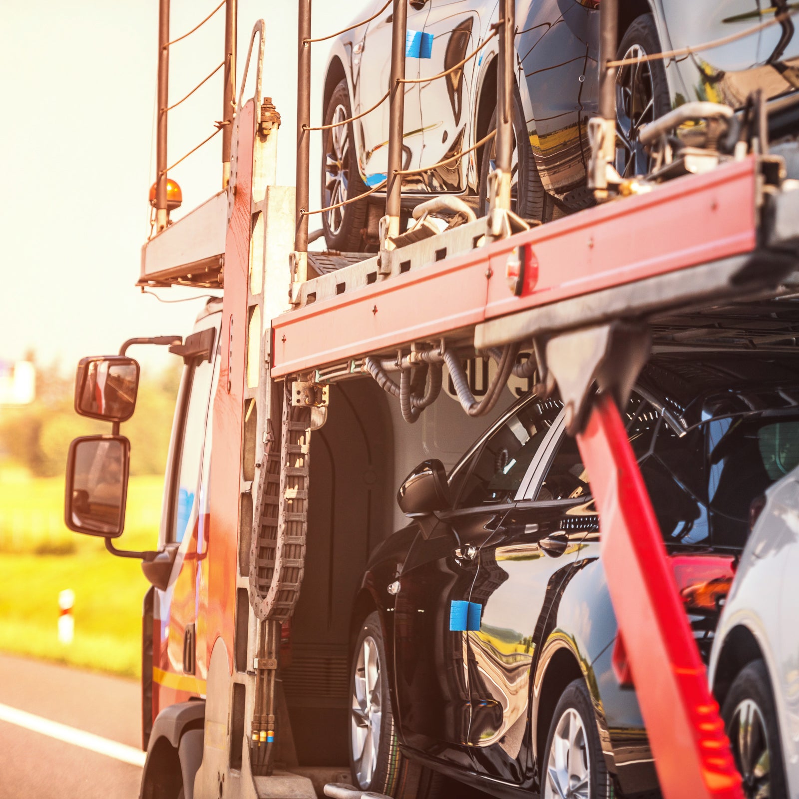 cars loaded on an 18 wheeler - City Business Shipping